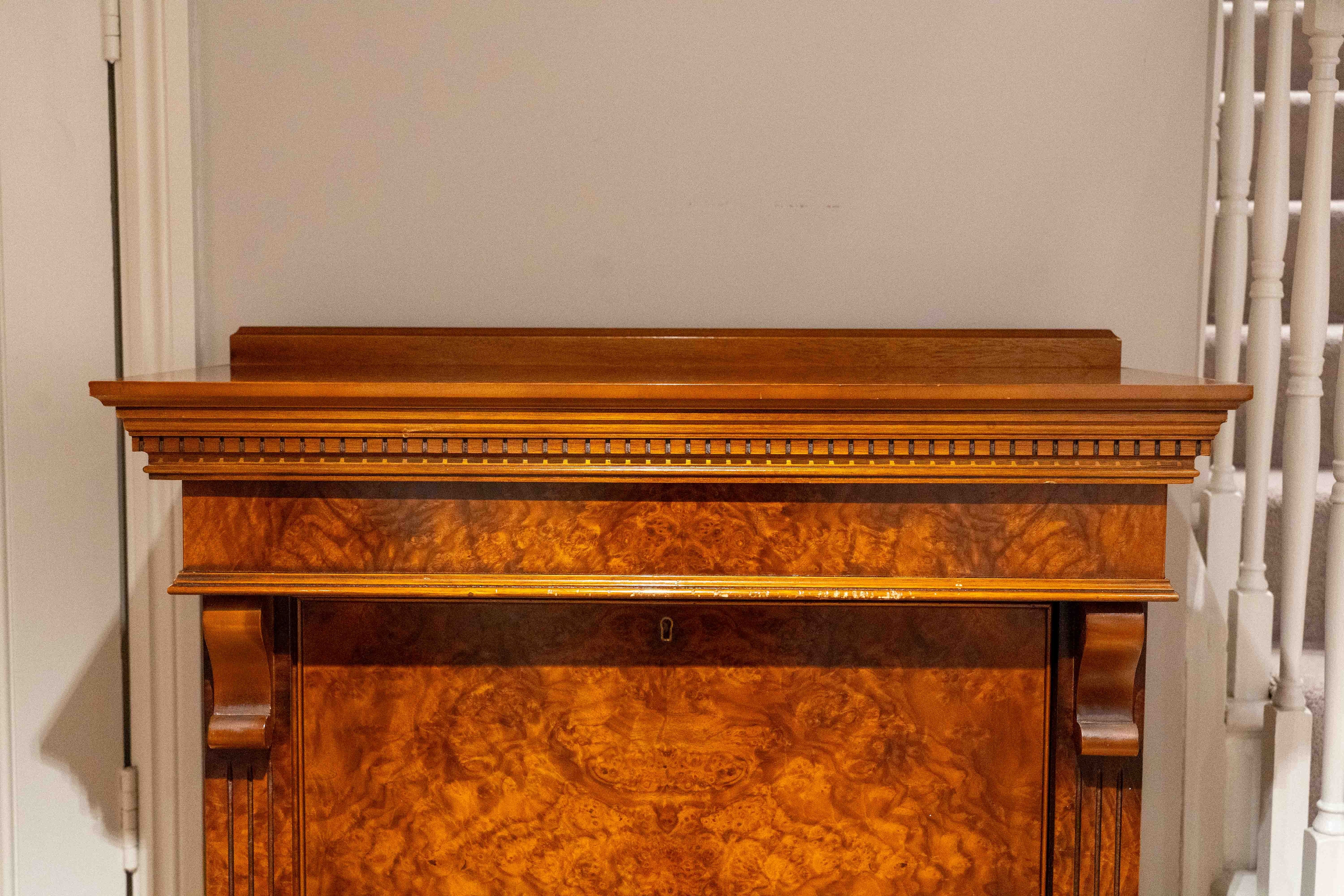 A reproduction burr walnut gun cabinet, width 84cm, depth 40cm, height 157cm. Condition - fair